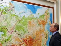Путин у карты России. Фото: t.me/oprichniksday